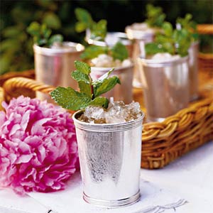 Mint julep cups with ice and mint garnishes