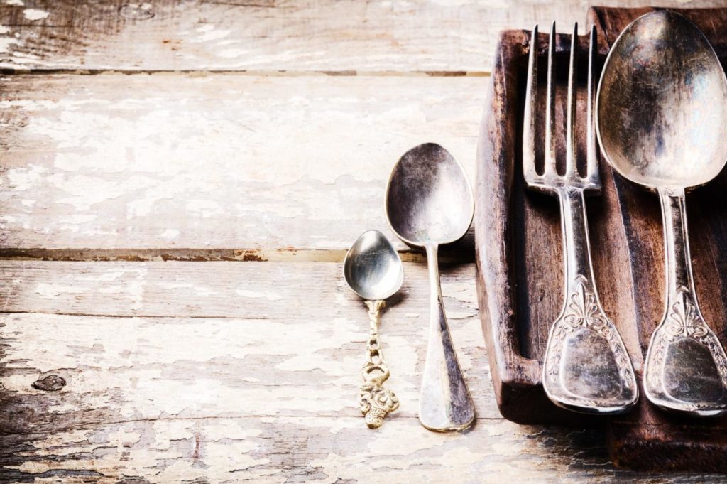 Antique Vintage Silverware on wood table