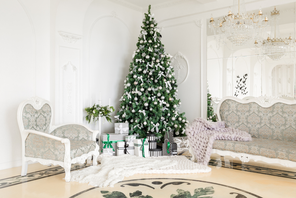 tall chrismtas tree in white colonial style room