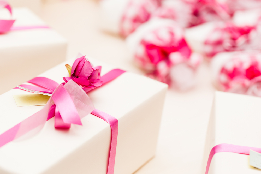 white presents wrapped with pink bows