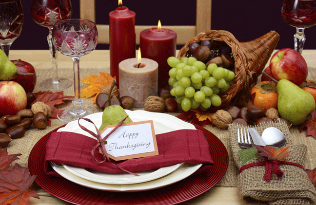 Dinner Table with lit candles and fruit