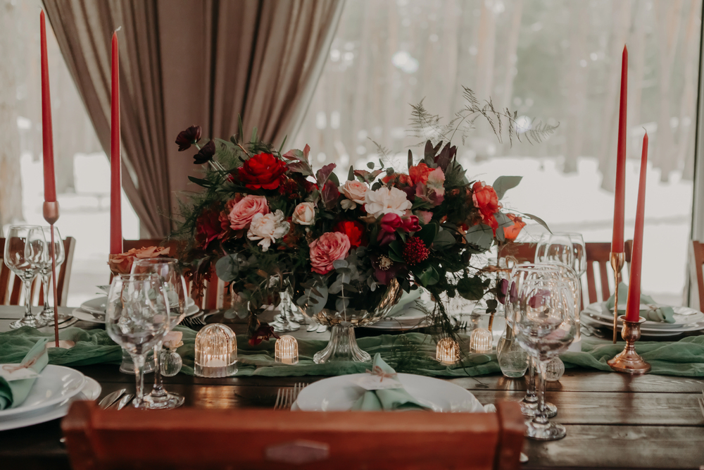 Beautiful centerpiece made of roses and red candles